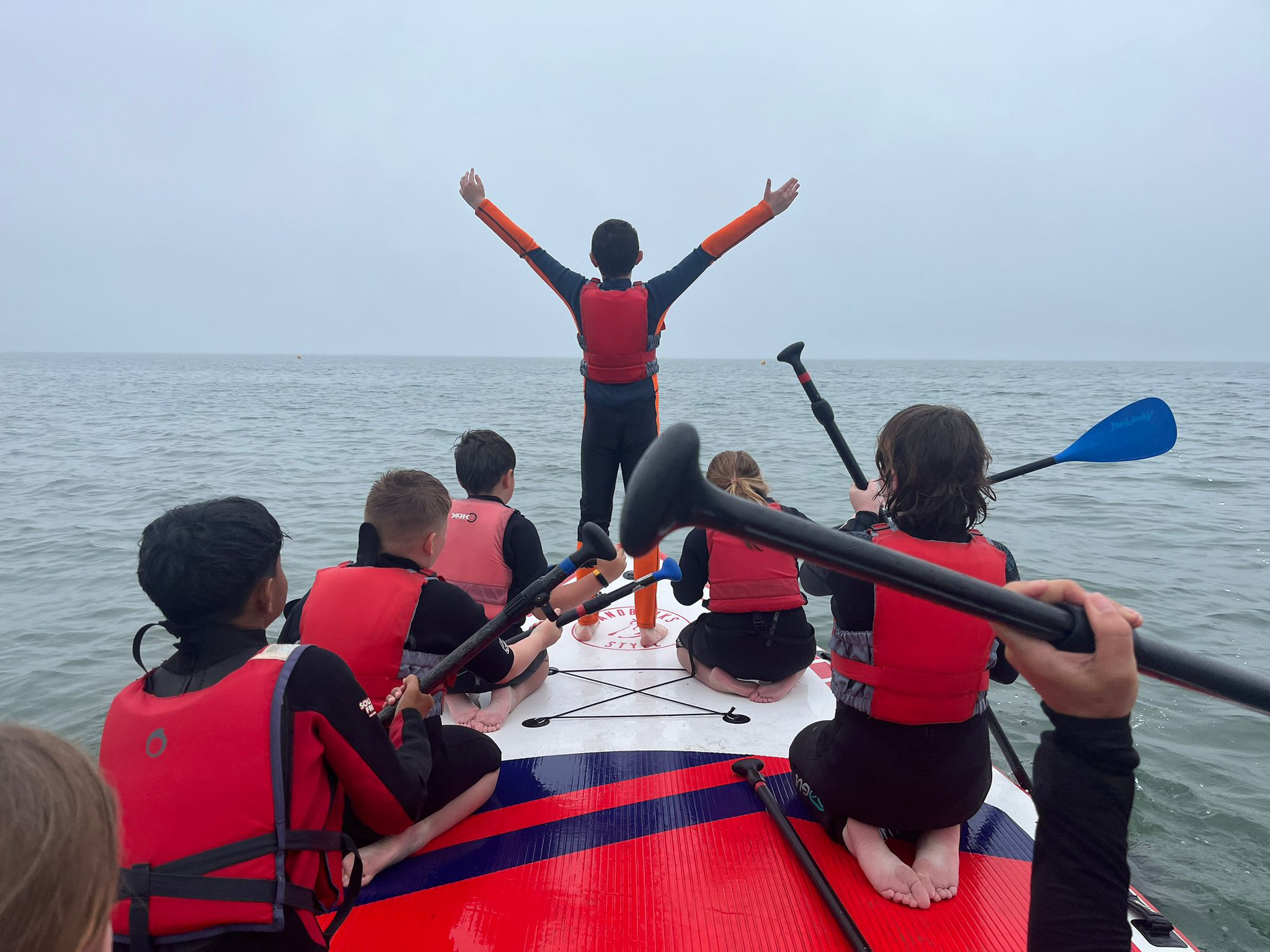 Year 5 enjoying paddle boarding in our beautiful locality.